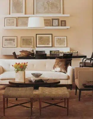 Why Antique Maps Are Trending in Home Decor Right Now 3 Living room decor featuring framed antique maps on the wall.